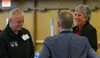 Rear Adm. Dan “Undra” Cheever, the U.S. Northern Command’s director of strategies, policies and plans, at left, talks with University of Alaska President Pitney, at right, and Daniel Neuffer,