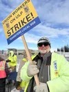Longtime school bus driver Steve remained positive on the picket line despite negotiations stalling between Durham School Services and Teamsters Local 959. Katie Stavick/Frontiersman