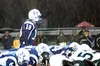 Palmer quarterback Charlie Bentti barks out calls during a
second quarter downpour on Friday. Photo by JEREMIAH BARTZ/
Frontiersman.