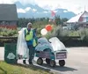 Roger Hemphill gathers recyclables at the Alaska State Fair last
week. The volunteer recycling effort is a more recent addition that
many fairgoers say they appreciate. Photo by EOWYN LeMAY
I