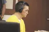 Andrew Victor Thomas listens through headphones during his sentencing Monday for beating a woman to death in 2010. He was sentenced to 99 years in prison for killing Susanna Braden. ANDREW WE