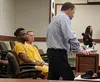 Shaquan M. Johnson, left, appeared before Palmer Superior Court Judge Jonathan Woodman for his first pretrial conference Friday morning. He faces felony counts of assault, armed robbery and b