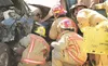ROBERT DeBERRY/Frontiersman Members of the Central Mat-Su Fire
Department work on extricating the driver of a suburban involved in
a three-car accident on the Palmer-Wasilla Highway near the 