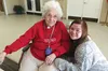 Burchell High School journalism student Donna Avery poses for a photo with former English Teacher, Mary Hall at the Wasilla Senior Center Sept. 30. Avery was there with a group of students in
