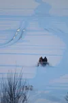 Authorities search for missing snowmachiners on Big Lake on Saturday.
