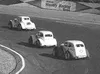 Doug Johnstone leads the Legends' second heat race with Steve
Marineau and Erik Johnson in close pursuit Saturday at North Star
Speedway. TIM BRODT/Frontiersman