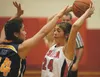 Wasilla's Amanda Hutchins looks for an open teammate during 2013 Doc Larson's Roundball Classic at Wasilla School. Hutchins, a 2014 graduate of Wasilla High, will has signed a National Letter