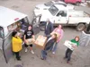 SEAN REILLY/Courtesy photo Students from Academy Charter School
in Palmer load a van with canned food and other dry goods. The
middle school student council organized and held a food drive to