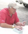 Wade Blasingame, who played 10 seasons in the major leagues
before retiring in 1972, signs autographs Wednesday at Hermon
Brothers Field in Palmer. A 1965 MLB All-star, Blasingame threw out
t