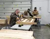 Lowe's staff and other volunteers build beds for local children at the Wasilla Boys and Girls Club in 2019. Frontiersman file photo.