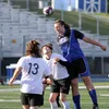 Palmer senior Caden Brown knocks a header toward the goal during a 4-0 win over Houston Thursday at Palmer High. Jeremiah Bartz/Frontiersman