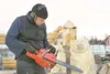 ROBERT DeBERRY/Frontiersman Jamie Rothenbuhler carves detail
into a wood bear's paw at his Wasilla along the Parks Highway
Monday morning. It takes Rothenbuhler about 30 minutes to create
the