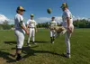In deep right field, a group of MatSu Miners relaxes before the game with the Anchorage Glacier Pilots with a game of hacky sack. Left to right: Pedro Comacho, Connor Mondey, Michael Malki an