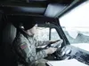 Alaska Army National Guard Sgt. Cody Foster, a petroleum supply specialist with E Company, 1st Battalion, 207th Aviation Regiment, returns the unit's Heavy Expanded Mobility Tactical Truck ta