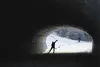 A skier heads down the trail through a tunnel on the Kincaid Trails course during the ASAA/First National Bank State Cross-Country Skiing Championships in Anchorage Thursday. Brooks Patton