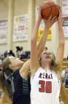 Colony's Paige Clary and Kenai Central's Brooke Satathite battle for a rebound Thursday at Kenai Central High School. Photo by Jeff Helminiak/Peninsula Clarion