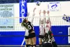 Colony senior Sophie Hall puts the ball over the reach of Wasilla's Ashlyn Dorn and Amber Sizemore during a 3-1 win over the Warriors Nov. 7 at Palmer High School. Jeremiah Bartz/Frontiersman