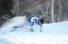 Palmer High School skier Manveer Singh braces himself for impact at the bottom of a tight downhill turn near the end of the boys' 5-kilometer, interval-start skate race at Government Peak on 