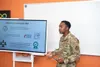 U.S. Air Force Tech. Sgt. Dalven Adams, a 673d Air Base Wing Staff Agency professional military education instructor, talks about the return on investment of a kiosk that would digitize docum