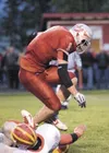 ROBERT DeBERRY/Frontiersman Wasilla’s Braydon Kuiper breaks a
West Valley Wolfpack tackle on a run for the end zone during
Friday’s game at Wasilla High School. Robert DeBerry