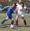 Wasilla’s Tabor Tingstad, right, battles Palmer’s Shea Riggs for
the ball during a game against the Moose last season. The Wasilla
senior recently signed a National Letter of Intent to play w