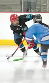 Mat-Su Ravens forward Josie Fletcher controls the puck during a game against Chugiak Eagle River at the Brett Memorial Ice Arena this past season. ROBERT DeBERRY/Frontiersman