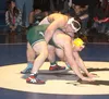 Colony’s Ian MacKenzie tries to stand during a win over Wasilla’s Quace Wright in the 220-pound final of the Northern Lights Conference Championships Saturday afternoon at Palmer High School.