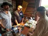 The creators of ‘Sudsy Slim Rides Again’ sell copies of the film and sign autographs during the ciy of Wasilla’s summer block party July 28 in Wasilla. Jacob Mann/Frontiersman