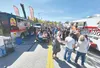 A lunchtime crowd peruses food truck options at a May 2025 Friday Fling. The popular summer weekly street festival, sponsored by the Palmer Chamber of Commerce, kicks off this year on May 15.