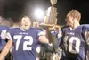 ROBERT DeBERRY/Frontiersman Palmer seniors Kelley Devon, left,
and Nate Svedin carry the Mayor’s Cup Trophy after beating Wasilla
in the annual Potato Bowl in October. Earlier this year Devon