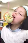 Rosie Hennemann plays the Soul Cake Game at All Hallow’s Eve Fest on Oct. 31 at Our Lady of the Valley Catholic School. Courtesy Karen Smith