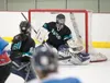 Mat-Su Ravens goaltender Emma Denny reaches for the incoming puck during the Ravens’ 4-1 win over Chugiak-Eagle River Friday evening at the Brett Memorial Ice Arena in Wasilla. ROBERT DeBERRY
