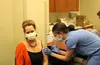 Dr. Anne Zink administers the COVID-19 vaccine Dec. 18, 2020, at Mat-Su Regional Medical Center. Tim Rockey/Frontiersman