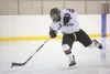 ROBERT DeBERRY/Frontiersman Houston junior forward Cody Lipse
takes a shot on goal during Thursday’s game against the Glennallen
Panthers at the Curtis C. Menard II Memorial Ice Arena in
Wasi