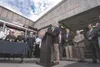 Gov. Sean Parnell, flanked by members of the Palmer Fire Department and several Alaska legislators, talks about the late Rep. Carl Gatto before signing House Bill 56 Monday at the Daniel M. C