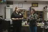 Palmer emergency dispatcher Allie Foley receives a stork-shaped pin from her boss, Palmer dispatch center supervisor Alaina Anderson, to recognize Foley’s service in helping a caller deliver 