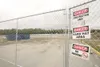 ROBERT DeBERRY/Frontiersman A chain link fence blocks access to
the property that Target is being built on at the intersection of
the Palmer-Wasilla and Parks Highway. The stores scheduled op