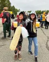Maverick Lundale, left, and Emmalie Casas enjoy the food, acrobats, and fireworks. Katie Stavick/Frontiersman