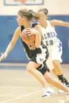 ROBERT DeBERRY/Frontiersman Houston's Ema Olson drives toward
the basket during Friday's game against Palmer at the Palmer Elks
Shootout basketball Tournament.