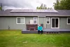 Stephen Trimble of Arctic Solar Ventures sits in front of one of his more recent solar installations on Palmer Fishhook Road. Katie Stark/For the Frontiersman