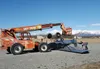 Workers prepare to try and turn a plane upright at the Palmer Airport on Monday after the aircraft flipped over on the runway. The pilot, who was the only occupant onboard at the time of the 