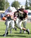 Wasilla junior running back Ricky Cunningham loses the ball
during the second half of the Warriors' 35-20 loss to Dimond last
week. The Warriors lost three fumbles against the Lynx. Photo by

