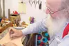 VICKI NAEGELE/For the Frontiersman Using leatherworking tools,
Bear Kelsey of Wasilla demonstrates his craft on a piece of scrap
leather. Kelsey will have items on display at his Two Bears
Le