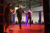 Naomi Mistor and Sophie O’Connell go head to head in a women’s boxing match inside the Alaska Combat Entertainment fighting cage. Jacob Mann/Frontiersman