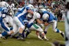 A gang of Palmer tacklers, led by lineman Colby Yuill and Tory
Johnson, stop Colony fullback David Craig after a short gain in
Palmer's 20-13 win over Colony earlier this season. The Knights
