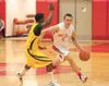 Wasilla senior guard Dillon Ferro moves the ball down the court
against the Carver (Ala.) Wolverines at the 2011 Doc Larson
Roundball Classic in Wasilla. ROBERT DeBERRY/Frontiersman