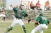 JEREMIAH BARTZ/Frontiersman Mat-Su catcher Nick Croce throws
over the head of pitcher Connor Hulse to get the out at first.