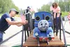 Volunteers with Alaska Live Steamers ready their float for the Fourth of July Parade in Wasilla. The group marks its grand re-opening with train rides from 10 a.m. to 4 p.m. all weekend at it
