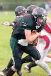 Senior Anthony Bricker runs for a gain during Colony’s 26-7 win
over Juneau-Douglas last week. Bricker has nearly 400 yards rushing
in two games. ROBERT DEBERRY/Frontiersman
