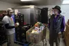 Mat-Su Food Bank Executive Director Eddie Ezelle talks to volunteer Josh Juell at the main office and food pantry located in the Good Shepherd Lutheran Church parking lot in downtown Wasilla.